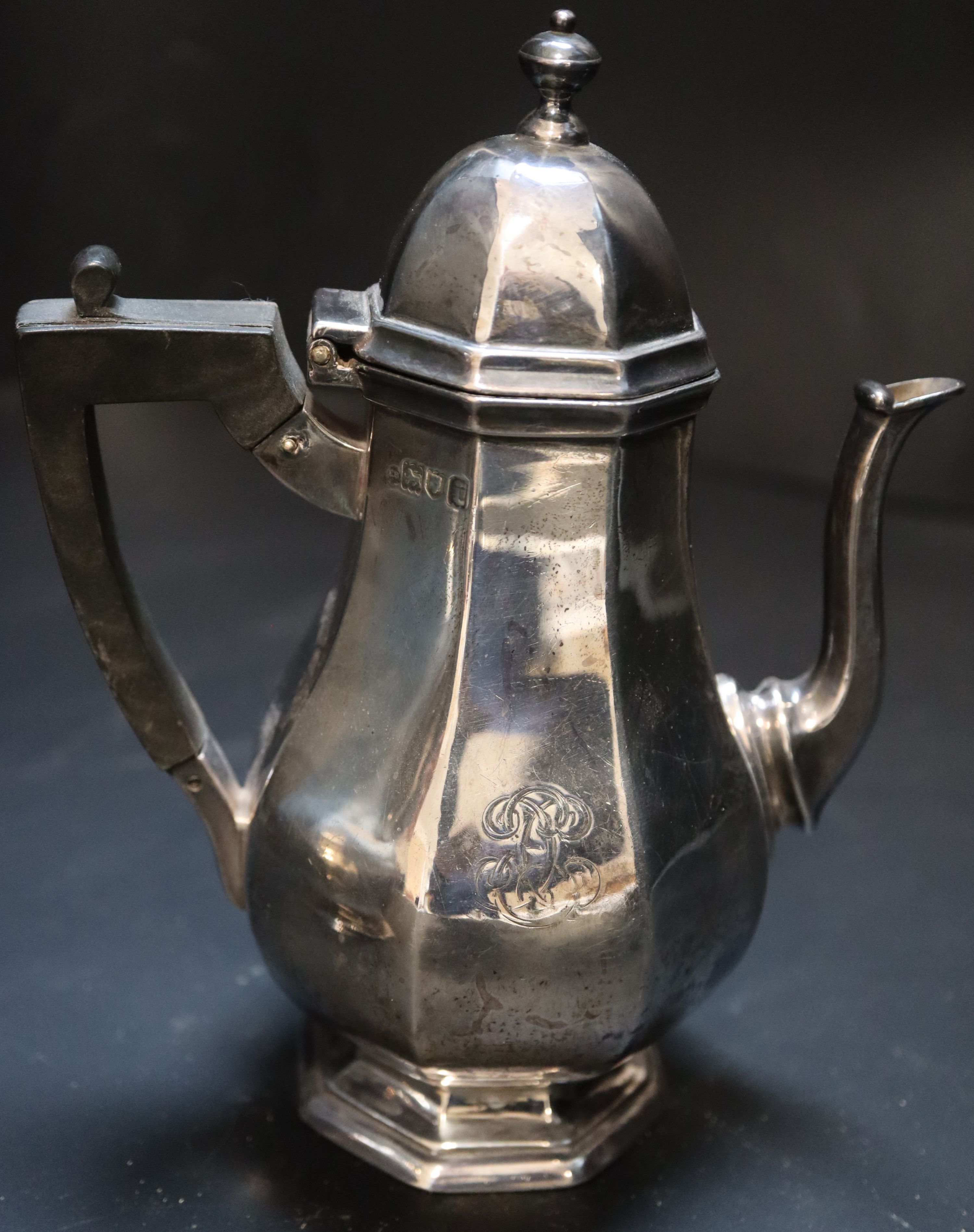 A pair of Edwardian silver café-au-lait pots, octagonal baluster bodies, monogrammed, Thomas Bradbury, London 1904
